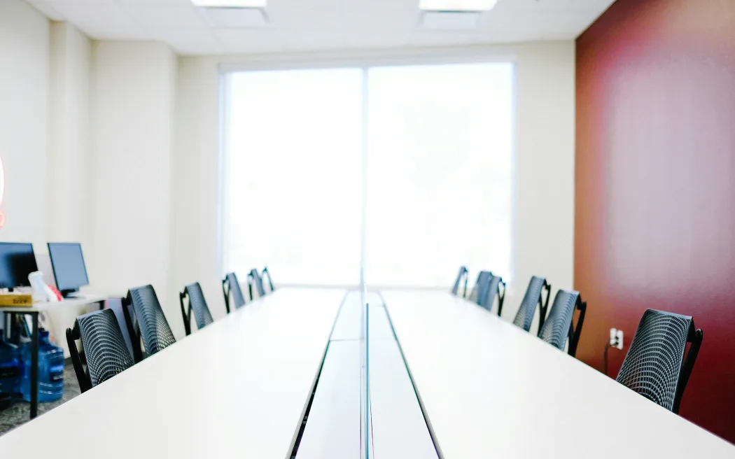 Empty chairs in an office meeting room.