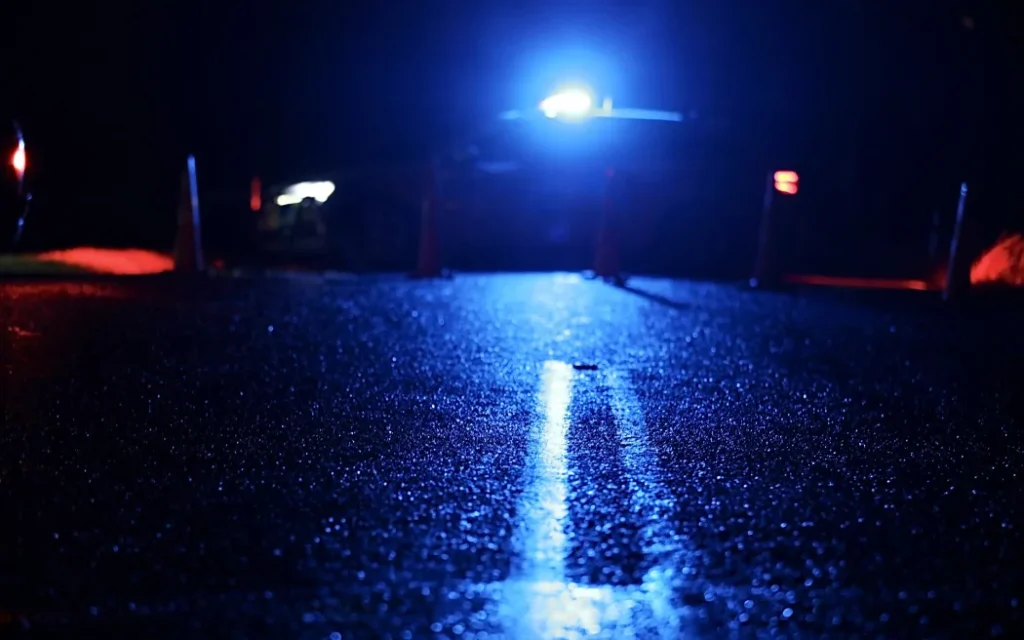 A police car parked across the road at the scene of a triple fatality in Waiuku, in July 2025.