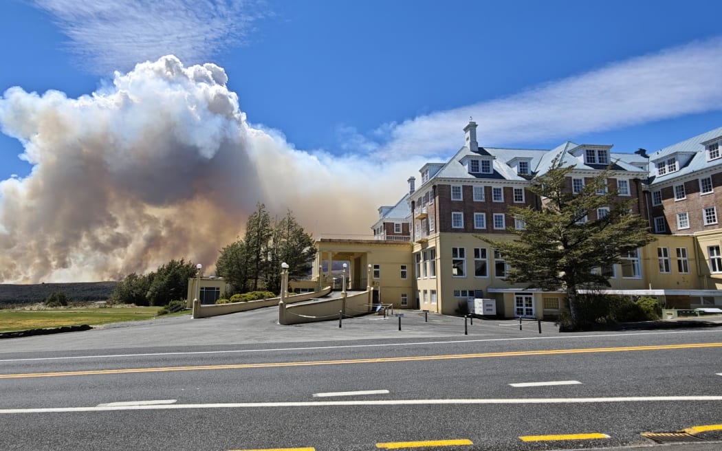 Smoke from the huge Tongariro National Park fire behind the historic Chateau Tongariro on Sunday 9 November 2025.