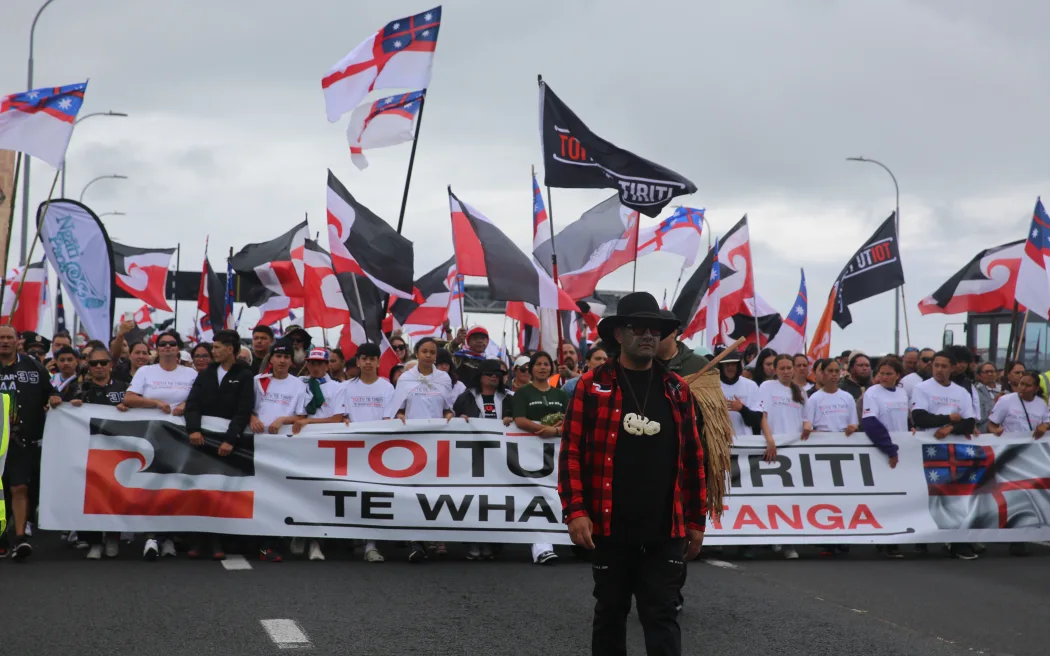 Te Pāti Māori co-leader Rawiri Waititi at the front of the hīkoi on Auckland's Harbour Bridge.