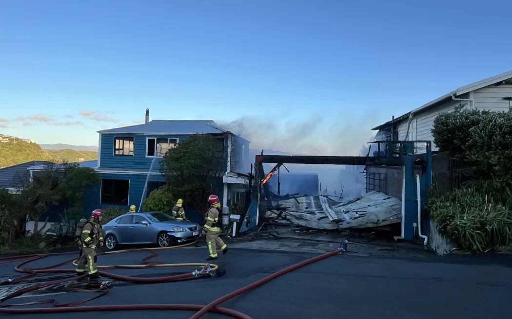 Firefighters at the scene of a house fire in Island Bay, Wellington, 3 November 2025.