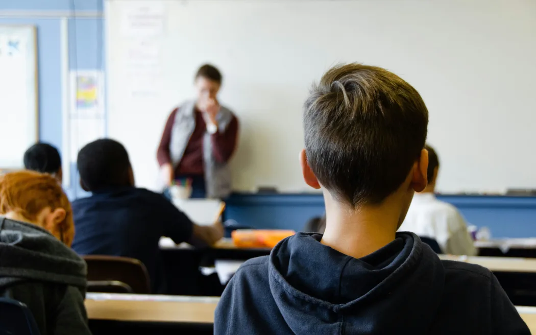 Students learning in a school classroom.