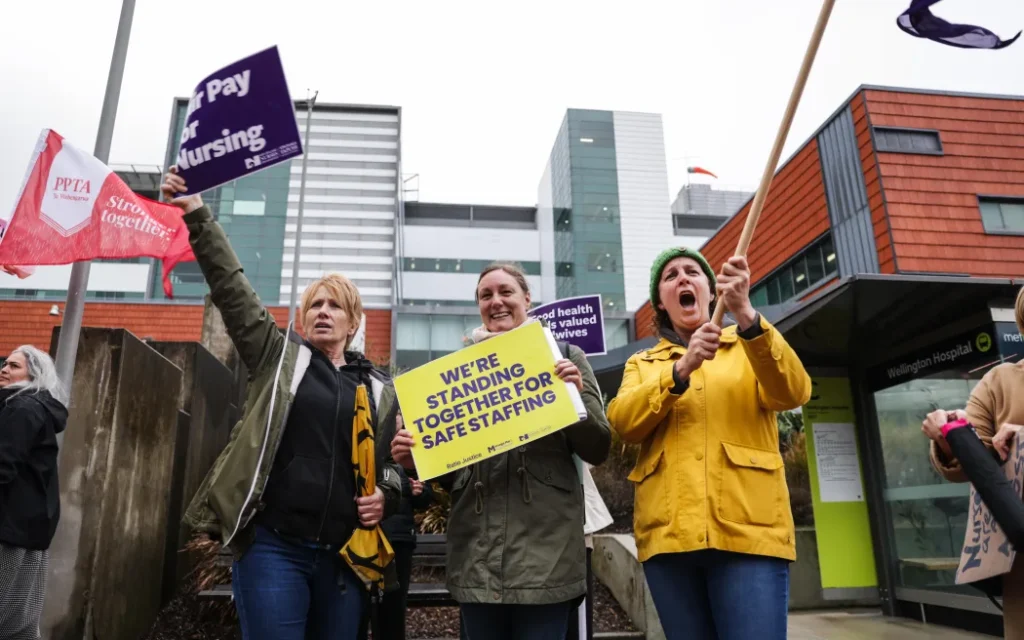 Healthcare workers hold placards at a picket line in Wellington. Nurses, midwives and healthcare assistants were on strike for 24 hours from 9am Wednesday 30 July 2025.