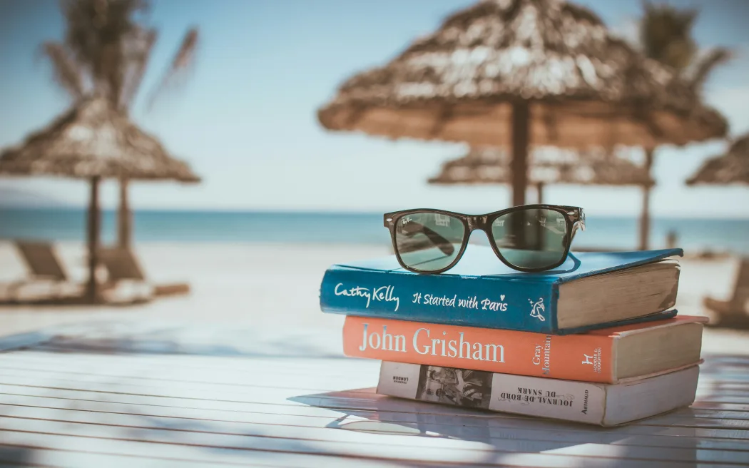 A stack of books on a table at an island resort